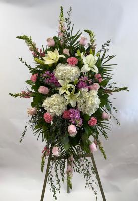 3 white lilies, 3 hydrangeas, 12 pink roses, 6 carnations, 3 stock, 8 snapdragons in standing spray