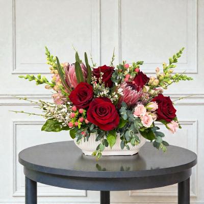 Premium red rose and protea flower arrangement
